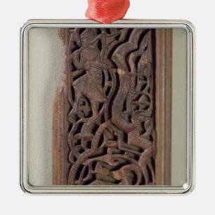Carved panel decorated with a lute player metal ornament