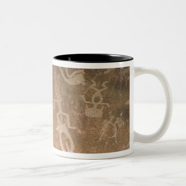 Carved petroglyph depicting figures Two-Tone coffee mug (Right)
