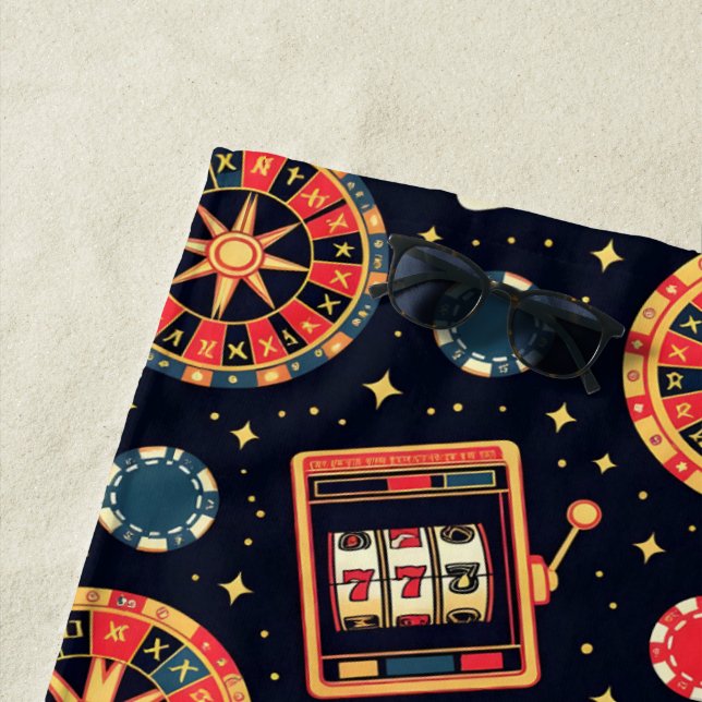 Casino pattern theme on black beach towel (In Situ)