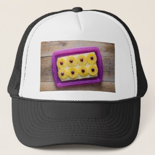 Casquette Hawaii slices with pineapple on rustic wood