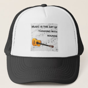 Casquette La musique pense avec son guitare