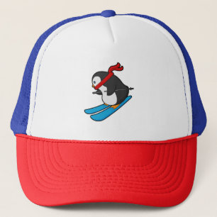 Casquette Pingouin comme skieur avec ski