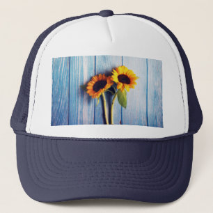 Casquette Sunflower on Blue Wood Wall