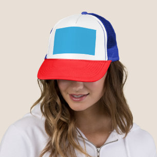 Casquette un arrière - plan bleu avec un chat noir et blanc
