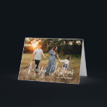 Casual Script Photo Modern Christmas Holiday Card<br><div class="desc">Modern photo Christmas card featuring a simple and minimal design with the greeting "Merry Christmas" in an elegant white script along with your family name.  The inside has a photo collage consisting of six square pictures.</div>