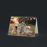 Casual Script Photo Modern Christmas Holiday Card<br><div class="desc">Modern photo Christmas card featuring a simple and minimal design with the greeting "Merry Christmas" in an elegant white script along with your family name.  The inside has a photo collage consisting of six square pictures.</div>