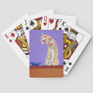 cat cleaning playing cards