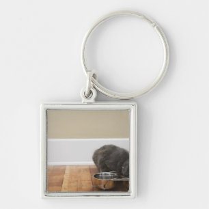 Cat eating from bowl keychain