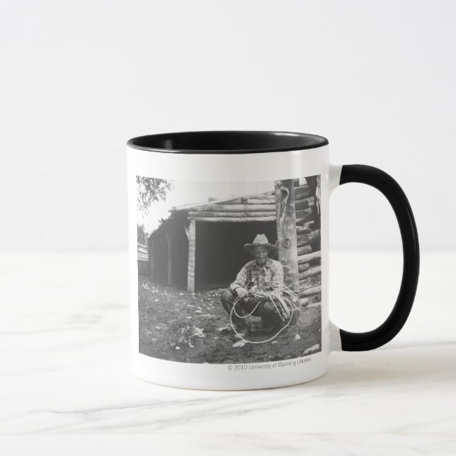 Cat eating out of a coffee can mug (Right)