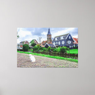 Cat in traditional fishing village canvas print