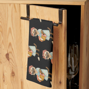 Cat is going to laundry kitchen towel