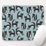 Cat Pattern Blue Mouse Pad<br><div class="desc">Cute black and white tuxedo cats going about their business. A fun pattern on a mid teal background, perfect for animal and pet lovers. Cats love a mouse. Original art by Nic Squirrell.</div>