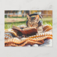 Cat reading book on knitted blanket