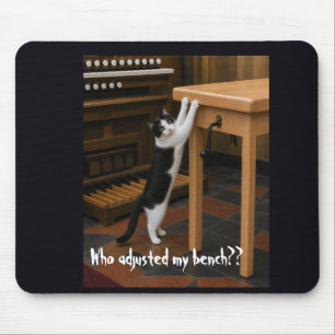 Cat scratching an organ bench mouse pad