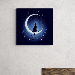 Cat silhouette swinging from the crescent moon canvas print