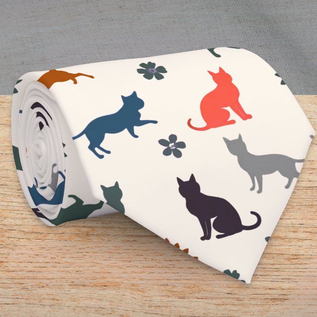 Cat Silhouettes Animal Pattern Elegant Tie (A cream tie with cat silhouettes in black, gray, blue, green and coral, with flower and leaf detail)