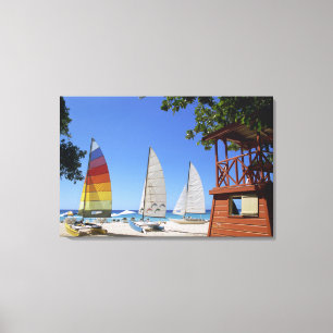 Catamarans And Lifeguard Stand On Beach Canvas Print