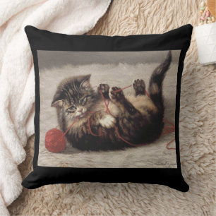 Cat's Cradle, A Cat Playing Ball of Yarn Throw Pillow