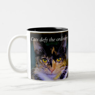 "Cats defy the ordinary" Coffee Mug