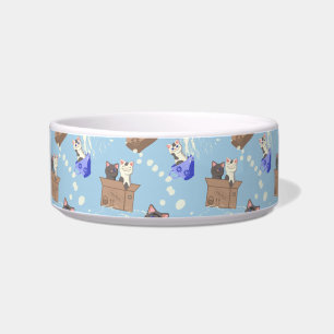 Cats in box and milk drops on blue bowl