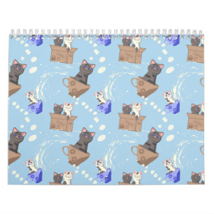 Cats in box and milk drops on blue calendar