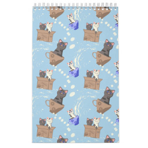 Cats in box and milk drops on blue calendar