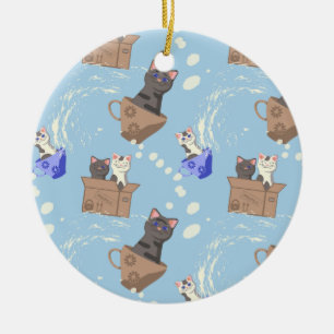 Cats in box and milk drops on blue ceramic ornament