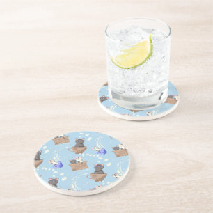 Cats in box and milk drops on blue coaster