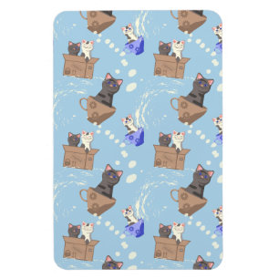 Cats in box and milk drops on blue magnet