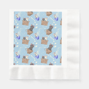 Cats in box and milk drops on blue napkin