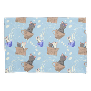 Cats in box and milk drops on blue pillowcase