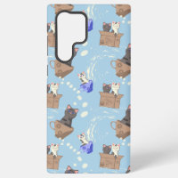 Cats in box and milk drops on blue