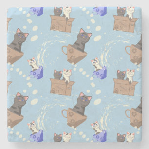 Cats in box and milk drops on blue stone coaster