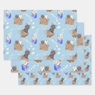 Cats in box and milk drops on blue wrapping paper sheet