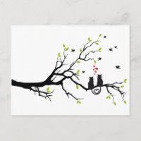 Cats in love with red hearts on spring tree