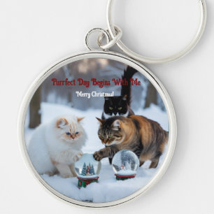 Cats playing with snowglobes keychain