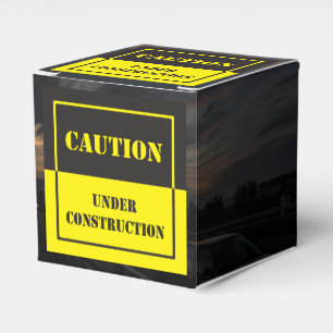caution under construction sign favor box