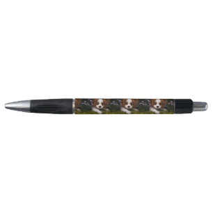 Cavalier King Charles Spaniel Puppy behind flowers Pen