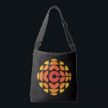 CBC 1974 Logo Crossbody Bag<br><div class="desc">Created by Burton Kramer, a designer and artist whose work is featured as part of the permanent collection at the Smithsonian Institute. Sometimes called the exploding pizza or pineapple, Burton Kramer's modernist logo features the letter "C" for Canada at its core. According to the CBC's 1974 corporate manual, "the overall...</div>