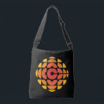 CBC 1974 Logo Crossbody Bag<br><div class="desc">Created by Burton Kramer, a designer and artist whose work is featured as part of the permanent collection at the Smithsonian Institute. Sometimes called the exploding pizza or pineapple, Burton Kramer's modernist logo features the letter "C" for Canada at its core. According to the CBC's 1974 corporate manual, "the overall...</div>
