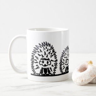 Ceramic mug featuring hedgehog family design