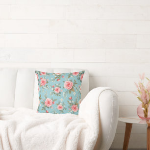 C'est un coussin à caractères floraux avec des ros