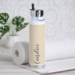 Champagne Colour Personalized Wedding Bridesmaid Water Bottle<br><div class="desc">Gift your wedding bridesmaid or maid of honour with this trendy, vacuum Insulated water bottle that features her name in grey, stylized script on a champagne colour background designed to match your wedding colour scheme. Personalize bottle by editing and replacing name with your own as desired. Select your water bottle...</div>