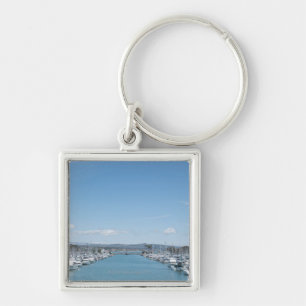channel in harbour on a sunny day with blue sky keychain