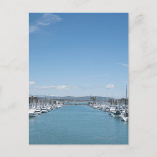 channel in harbour on a sunny day with blue sky postcard