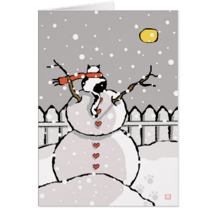 Chat de vacances assis sur la nuit neige de Snowma