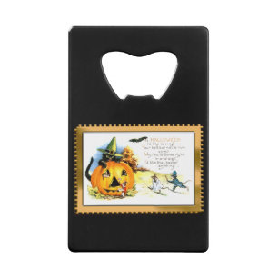 Chat d'Halloween assis dans une citrouille lumineu