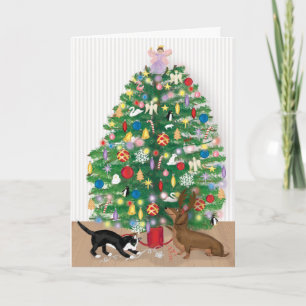 Chat et dachshund sous la carte sapin de Noël