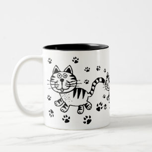 Chat et tasse mignons d'empreintes de pattes