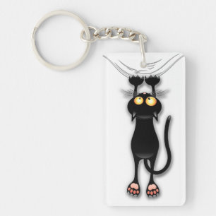 Chat noir d'amusement tombant vers le bas porte -